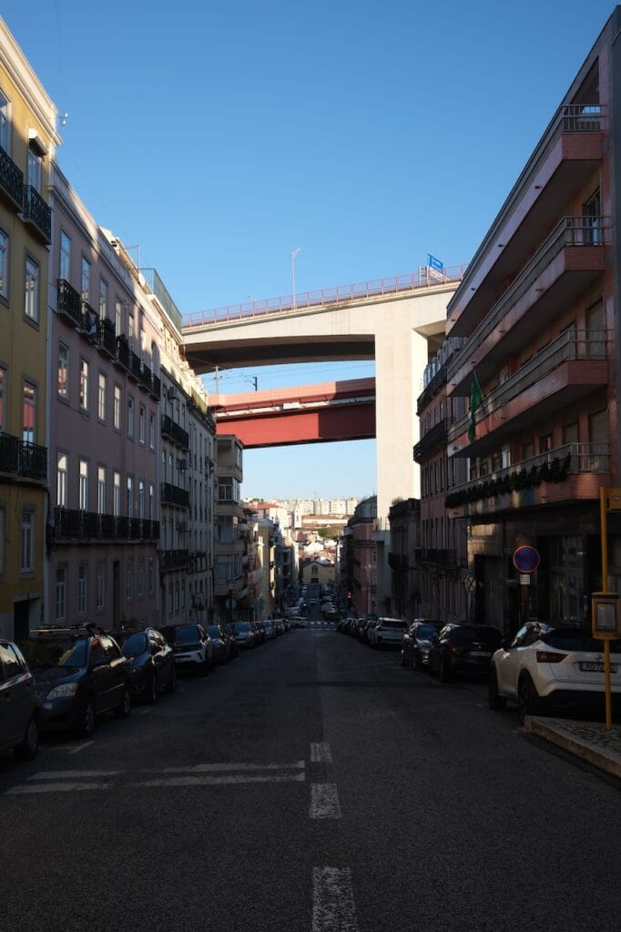 A wide city avenue lined with buildings.