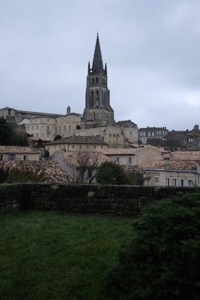A view of Saint-Emilion with its bell tower above the rooftops.