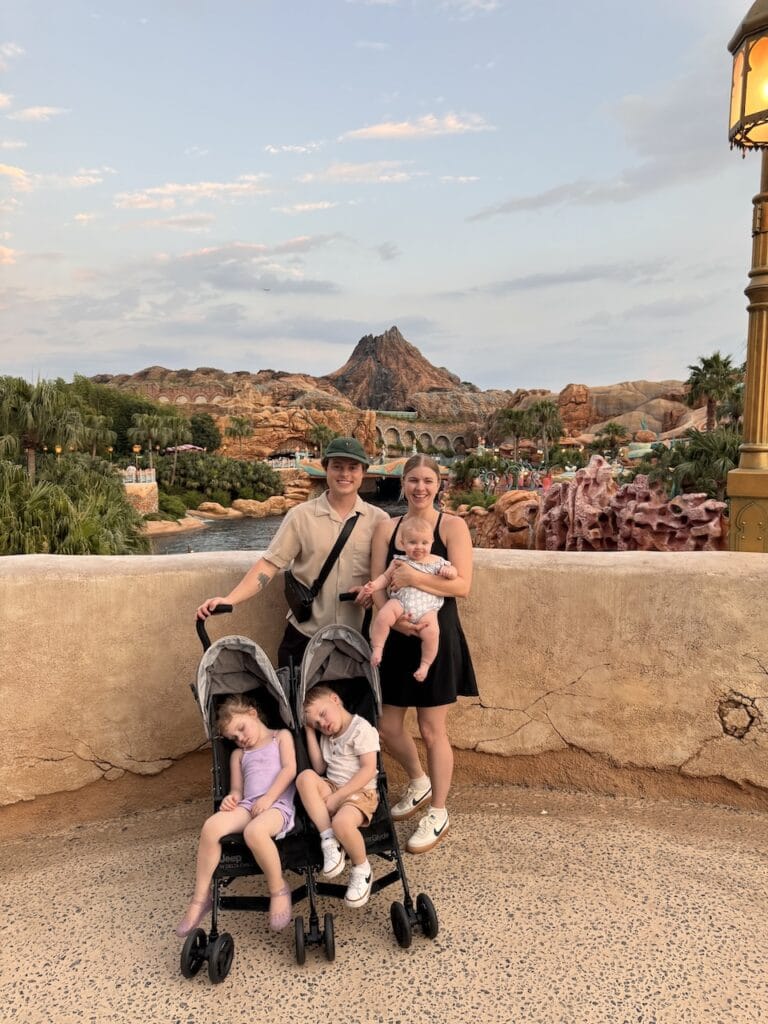 The family walking through a valley of rock formations.